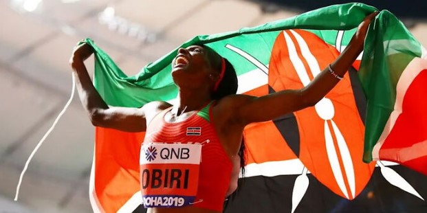 Kenyan Marathoner Hellen Obiri celebrates after winning a marathon.